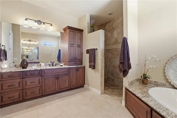 Full bathroom featuring vanity and walk in shower