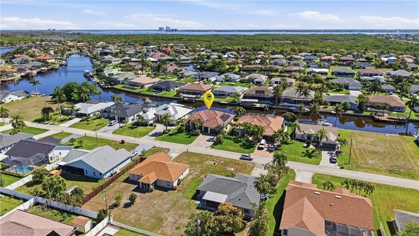 View of property location featuring nearby suburban area and a nearby body of water