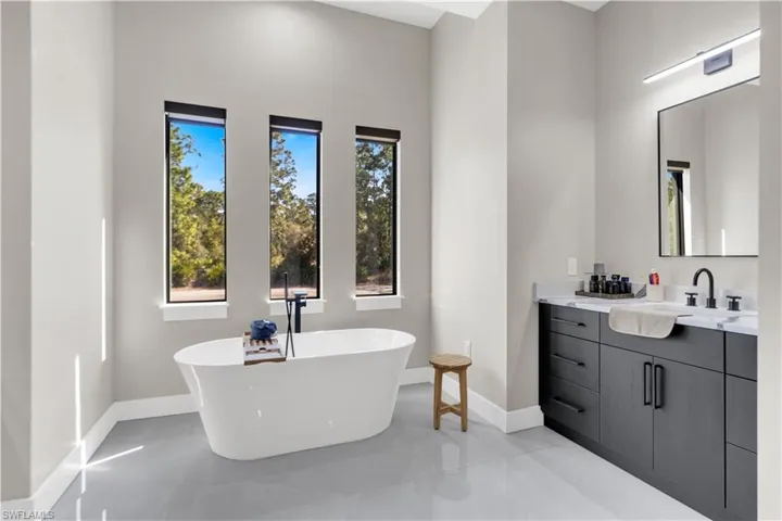 Bathroom featuring a freestanding bath and vanity