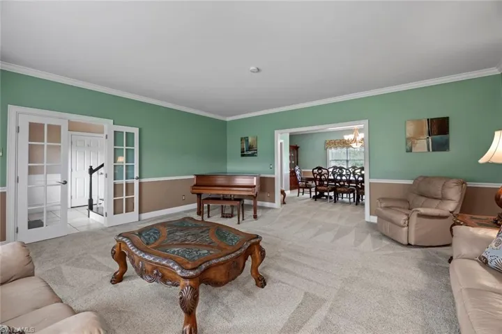 Formal living area w/French doors that open to Foyer and another to dining area