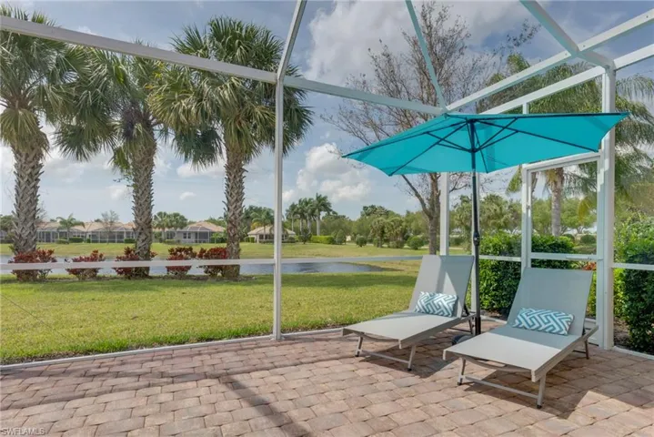 Unfurnished sunroom with a water view