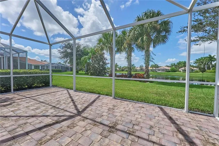 Unfurnished sunroom with a water view