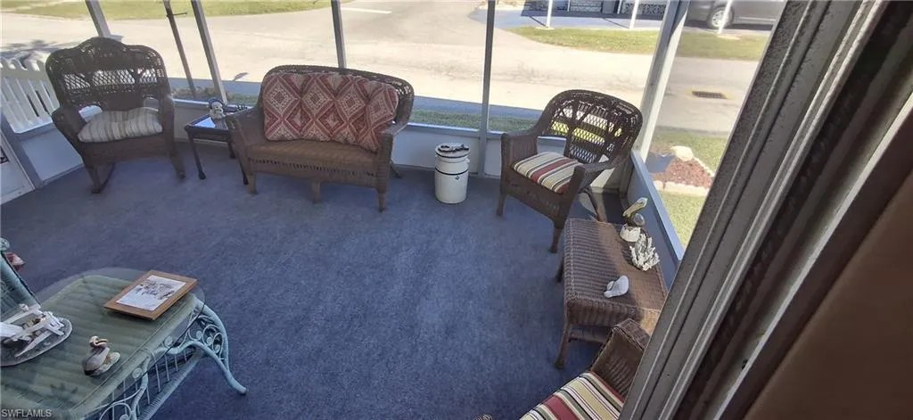View of sunroom with new outdoor carpet