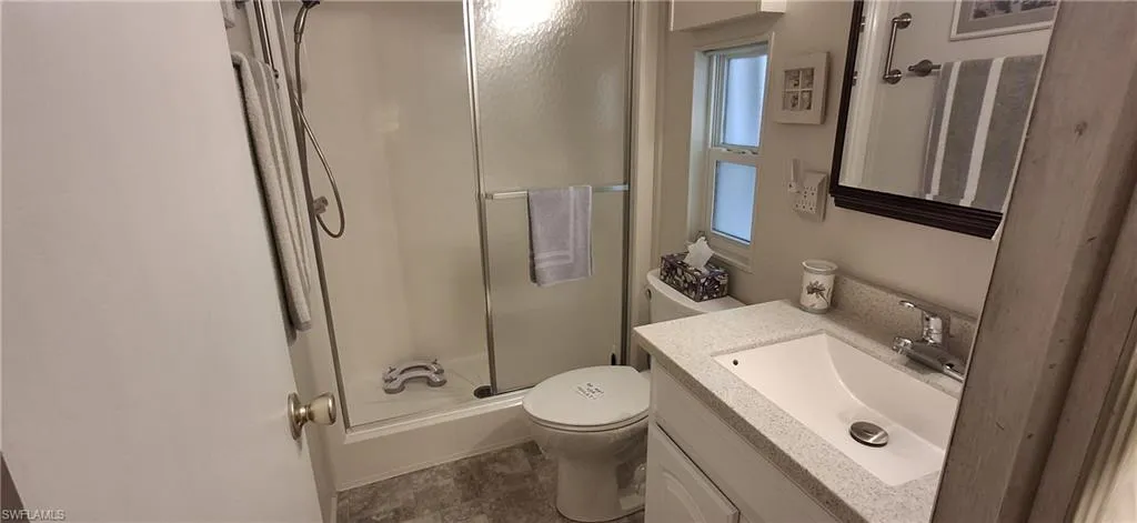 Master bathroom bathroom with vanity, walk in shower with glass door, new vanity/sink and exhaust fan