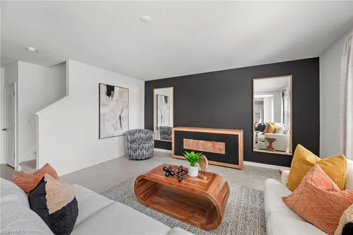 Neutral tone wall colors, built-in staircase, recessed lighting, and tile flooring