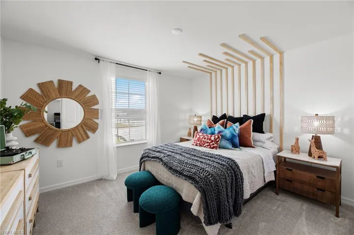 Wall-mounted natural wood paneling, light-toned carpet, recessed ceiling lighting, and a window with blinds