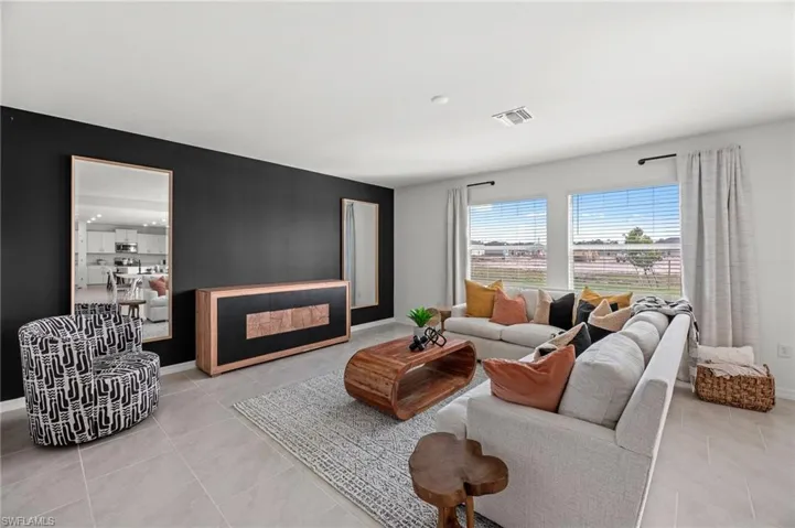 Tile flooring, recessed lighting, and expansive windows