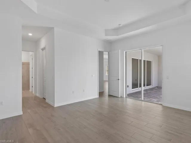 Large Primary Bedroom with Sliding Glass Door to Covered Lanai