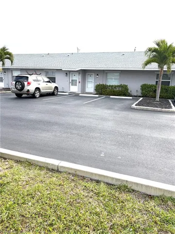 Unit 115 parking space and front door Entrance