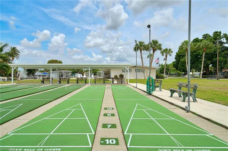 View of property's community with a yard