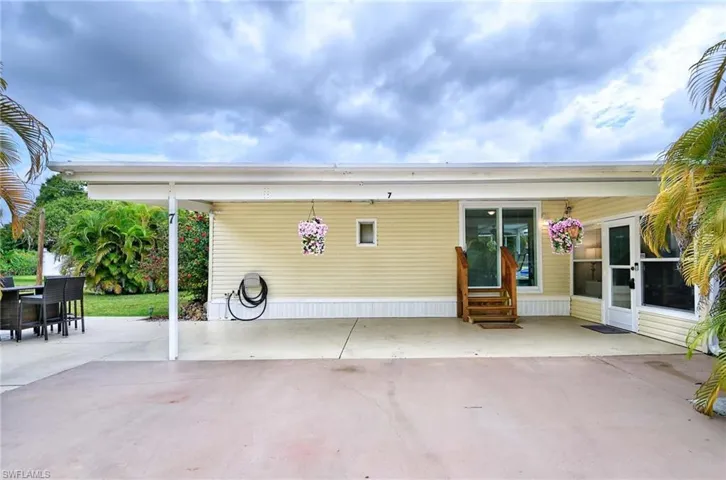 Rear view of house featuring a patio