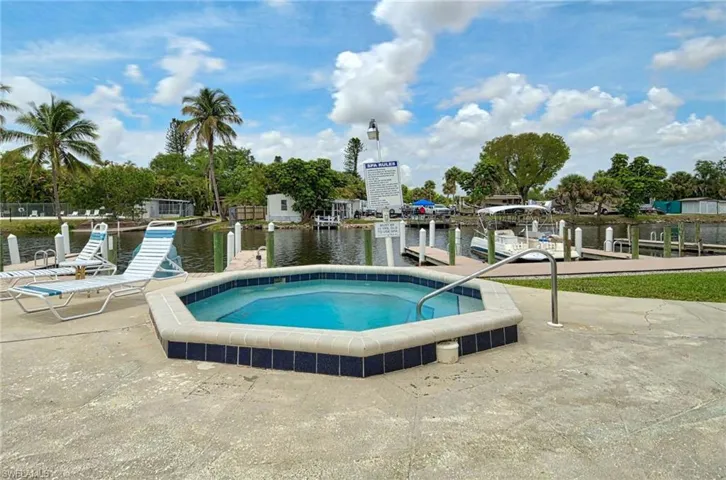 View of swimming pool with a water view
