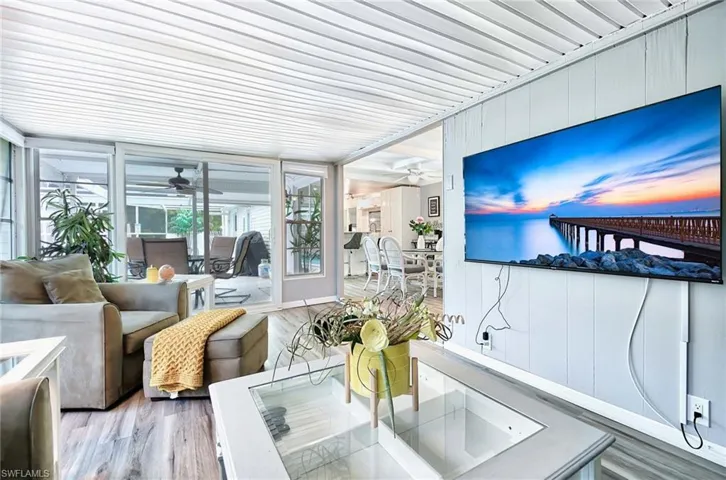Sunroom featuring ceiling fan