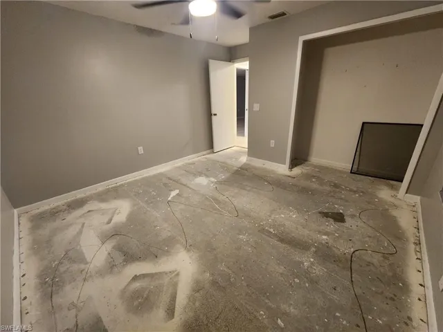 Unfurnished bedroom featuring ceiling fan