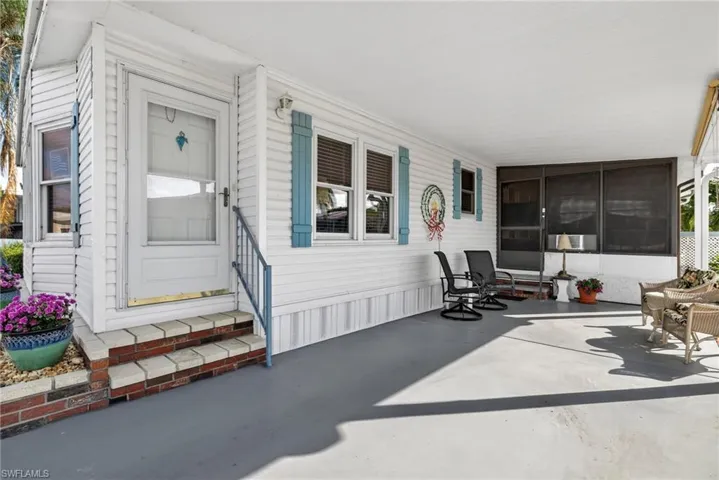 View of patio / terrace featuring a sunroom
