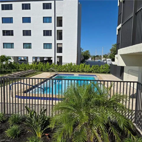 Community pool with a patio area