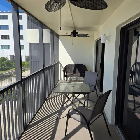 Balcony featuring ceiling fan