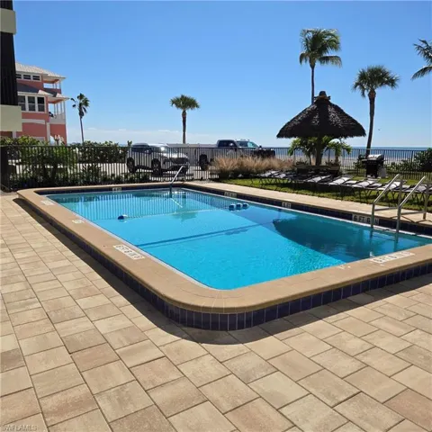 Community pool with a patio area