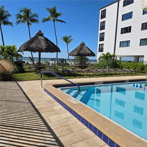 Community pool with a patio area