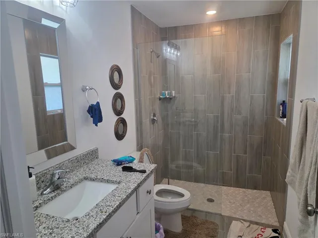 Bathroom with vanity and walk in shower