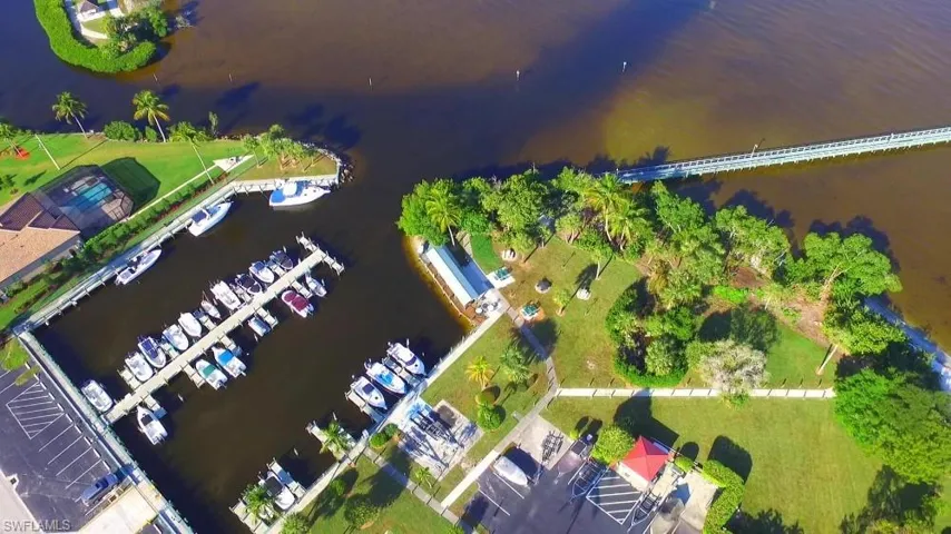 Drone / aerial view of a large body of water and a marina