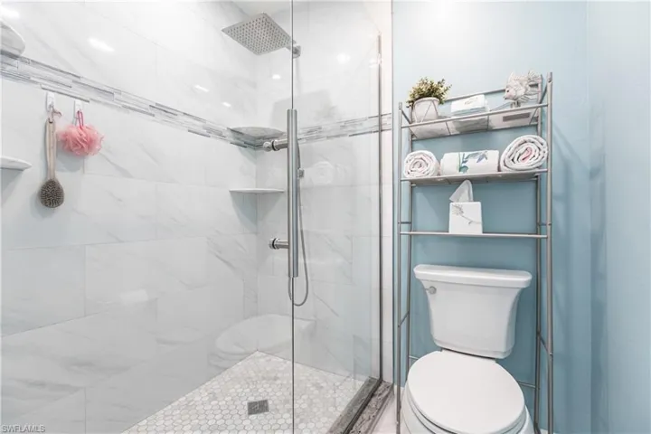 Bathroom featuring a shower stall