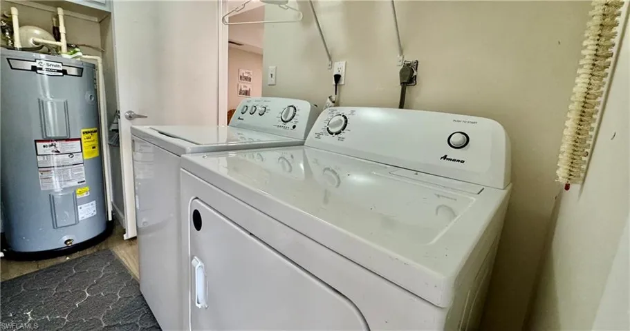 Washroom with electric water heater and washing machine and clothes dryer