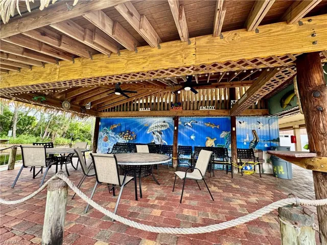 View of patio / terrace with outdoor dining space and a ceiling fan