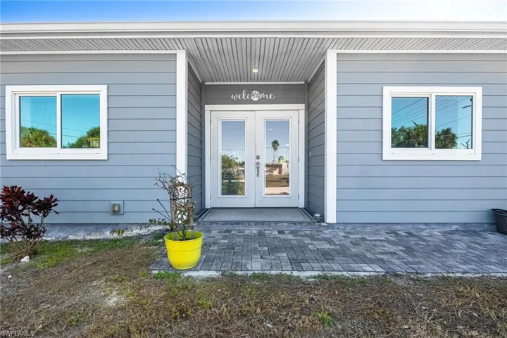 Doorway to property featuring french doors