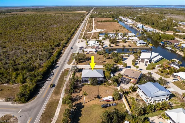 View of property location featuring nearby suburban area and a nearby body of water