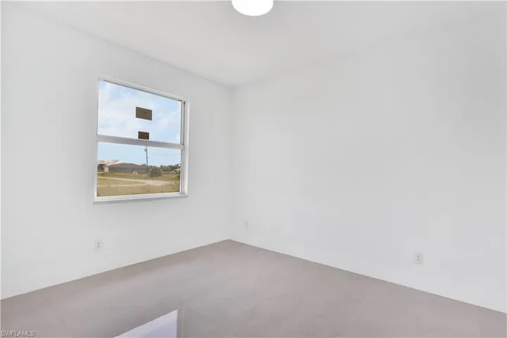 Unfurnished room with tile patterned flooring