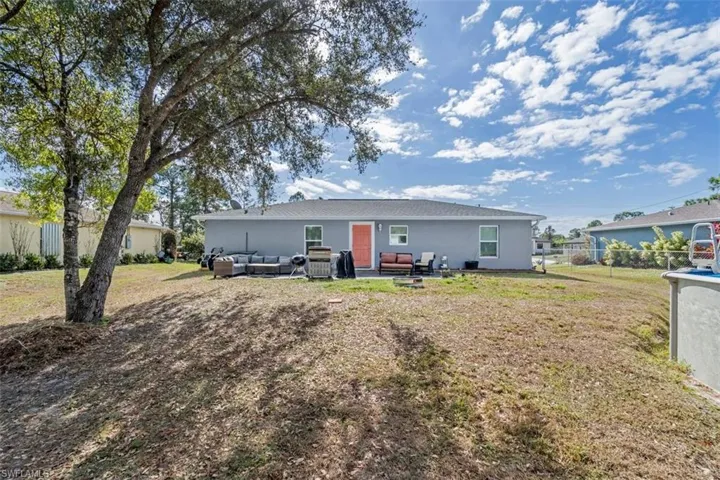 Rear view of property featuring outdoor lounge area and a patio