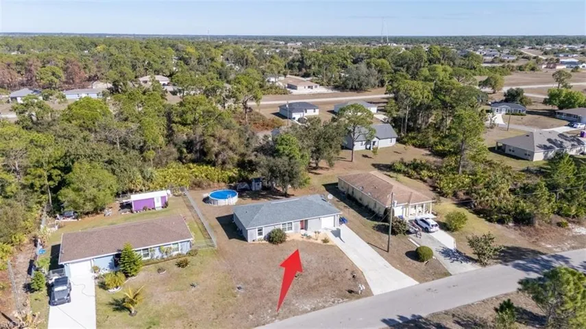 Aerial overview of property's location featuring nearby suburban area