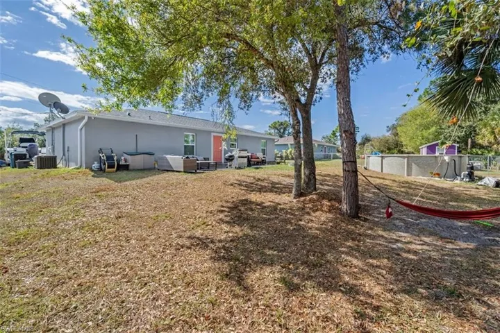 Rear view of property with stucco siding and a patio