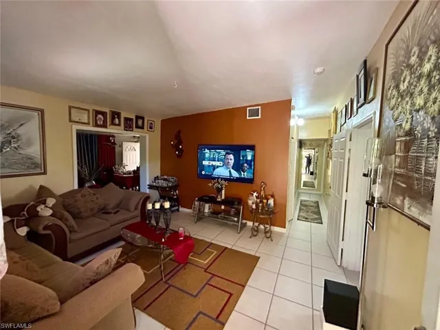 Living area with light tile patterned floors