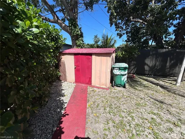 View of yard with a storage shed