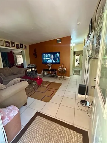 Living room featuring tile patterned floors