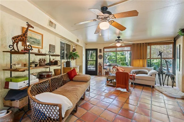Sunroom featuring visible vents