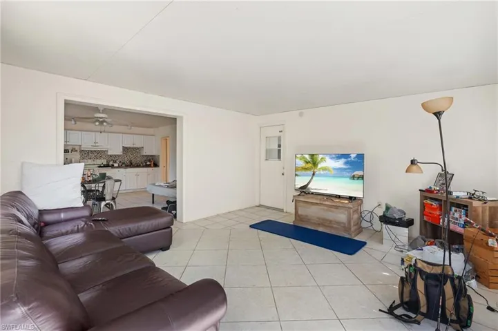 Living area with light tile patterned flooring