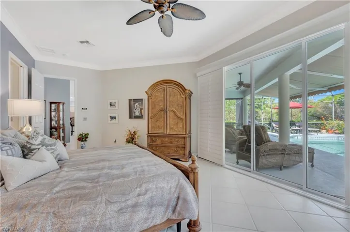 Primary Bedroom w/ view of the pool