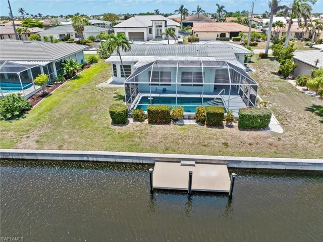 Aerial view of residential area with a nearby body of water