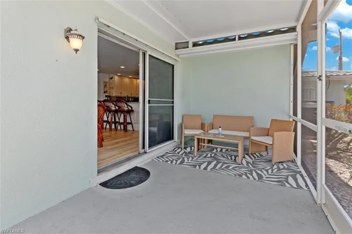 Covered patio area near pool.