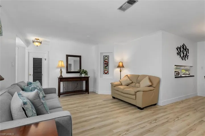 Living room featuring light wood finished floors and baseboards