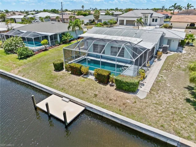 Aerial view of residential area featuring a large body of water