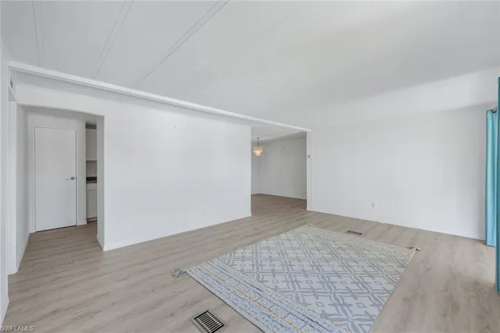 Family room with light hardwood-style flooring