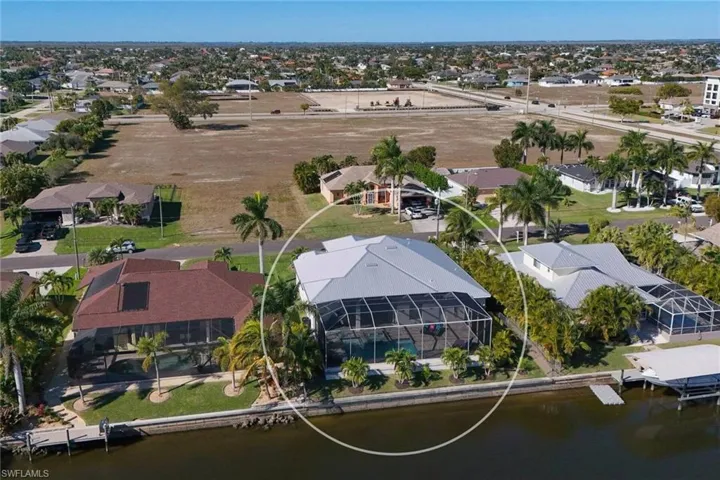 Aerial perspective of suburban area with a nearby body of water