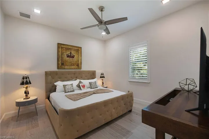 Bedroom featuring light wood-type flooring and ceiling fan