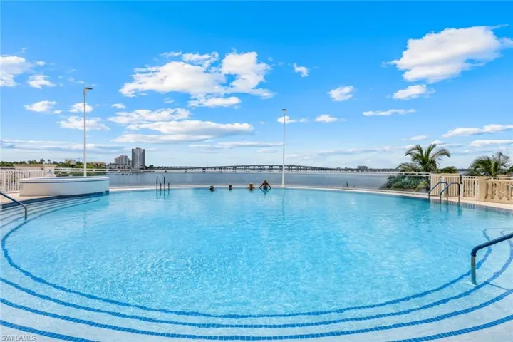 Community pool with a water view