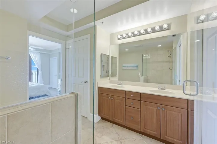 Ensuite bathroom with double vanity and tiled shower