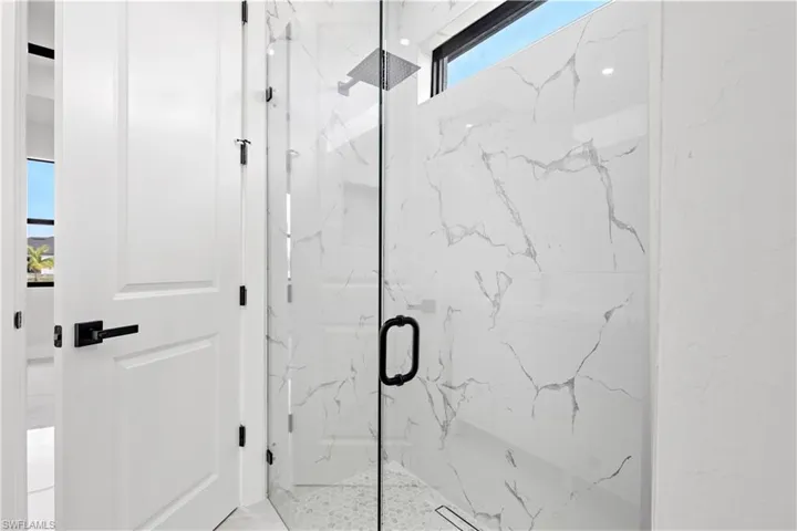Bathroom featuring a shower with shower door